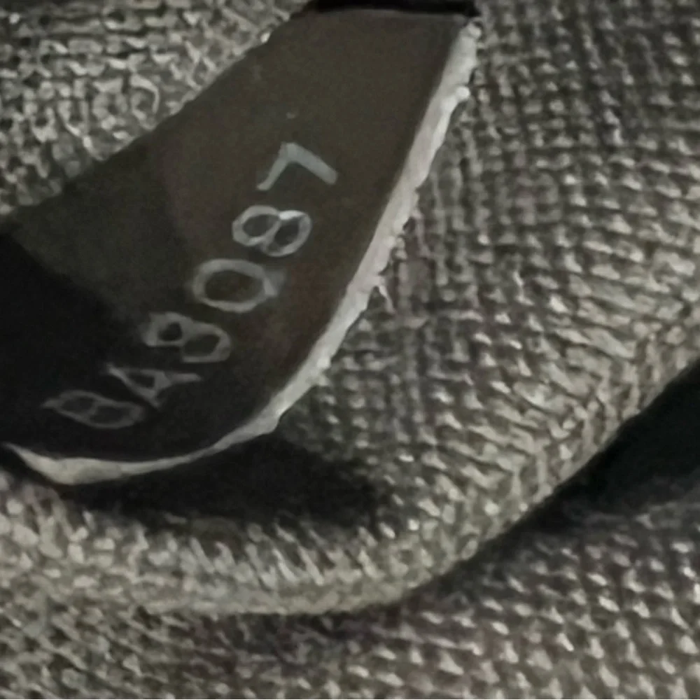 Louis Vuitton Taiga Roman Leather Messenger Bag.